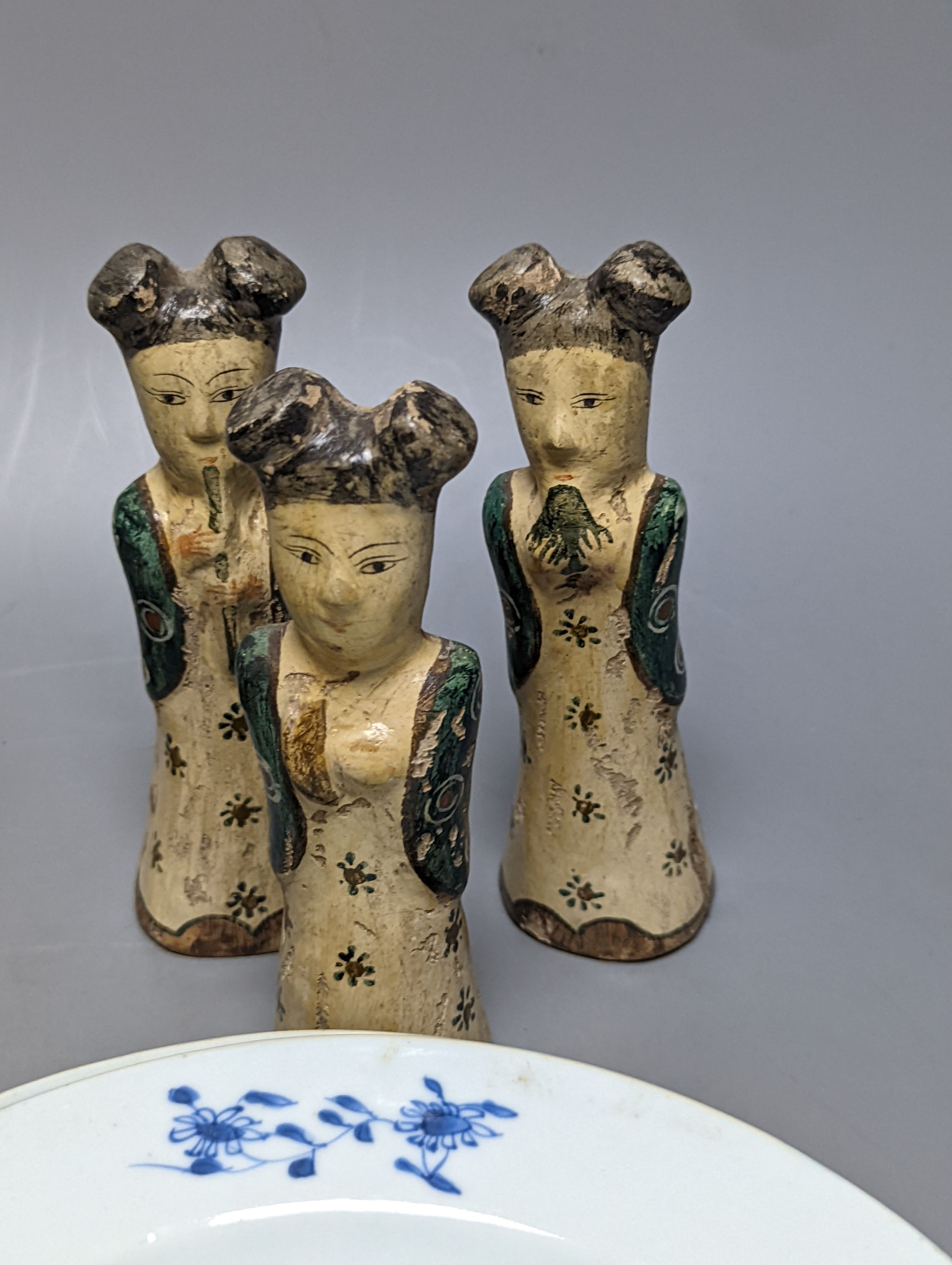 Six Chinese pottery figures and a mug and two plates, largest plate 24 cms diameter.
